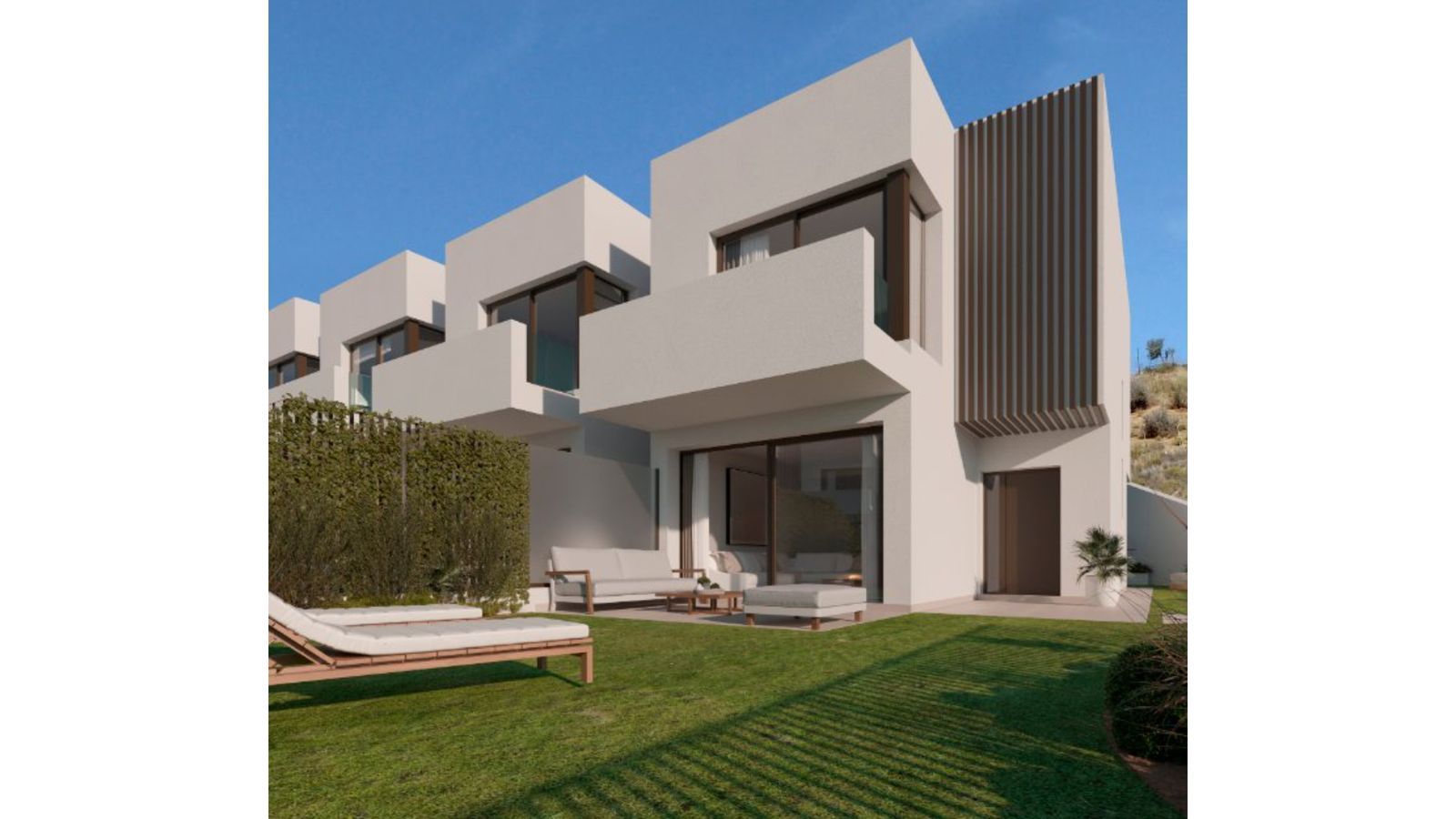 Exterieur van een modern Idilia Meraki huis met tuin en terrasmeubilair.